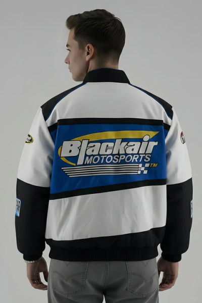 Person wearing a Blackair Motorsports jacket on a grey background and giving Back Pose