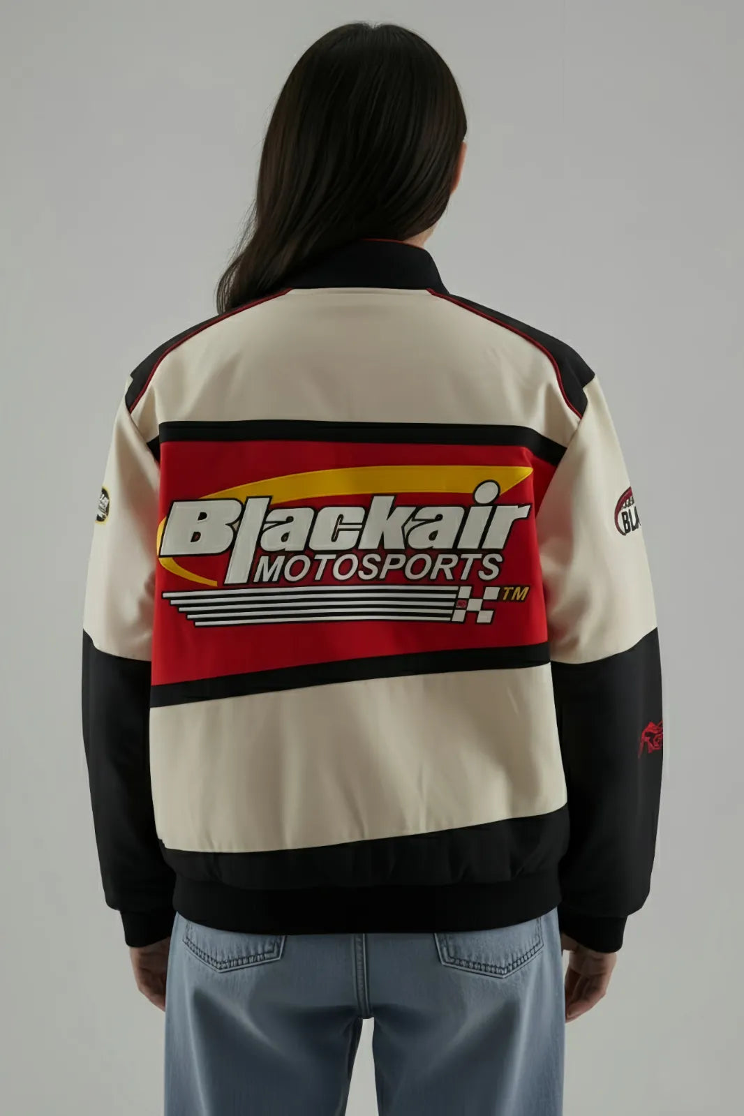 Back view of Women's Oversized BlackAir Jacket with retro racing graphics.