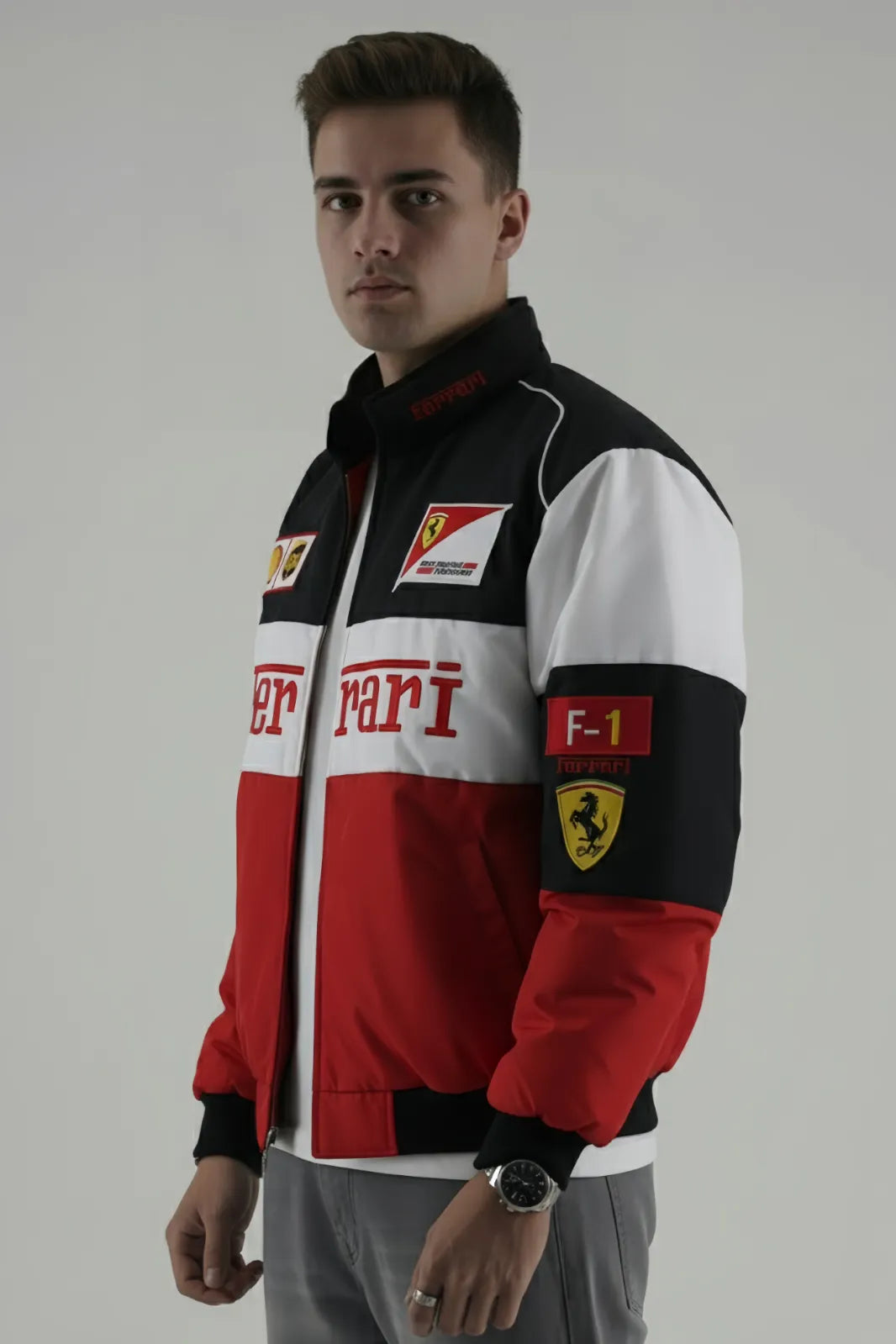Person wearing a Ferrari jacket with red, white, and black design on a gray background