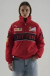 Front profile of the Red & Black Ferrari Racing Jacket Performance Edition featuring an aero-defense shell.